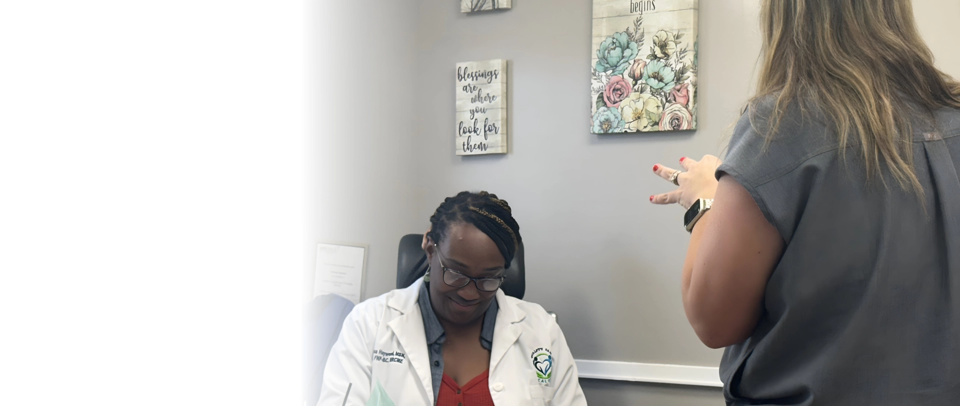 A male and a doctor smiling together